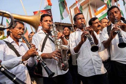 Band members play music as they take part in a rally, in soliderity with the Indian armed forces in