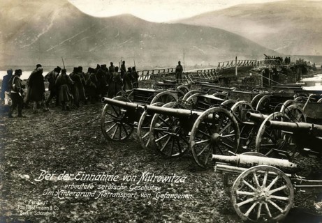 Serbian guns captured during the capture of Mitrovitsa. In the background, transport of prisoners,