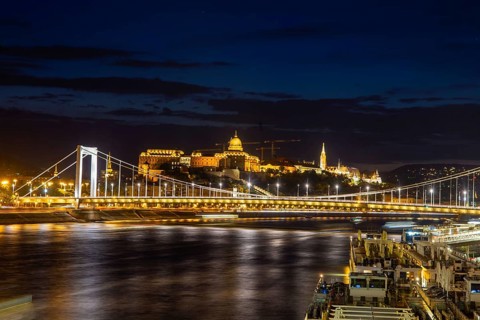 Budapest at night with the Danube, the illuminated Elisabeth Bridge and the illuminated Castle