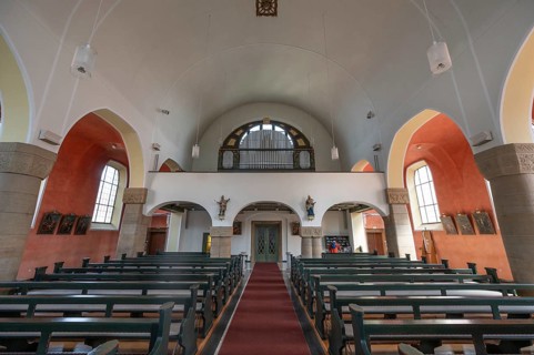 Interior with organ loft of St Stephen's Church, Art Nouveau building designed with neo-Romanesque