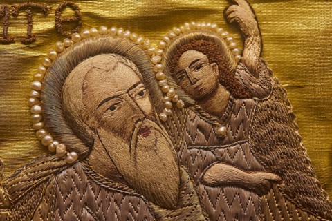 Detailed embroidery of a saint with pearl jewellery on golden fabric, Museum of Icon Painting,