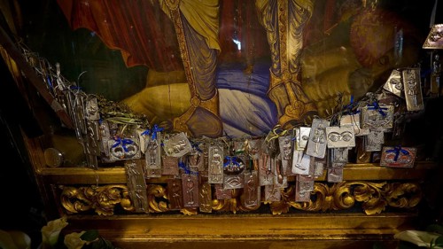 Interior view of a church with magnificent frescoes on the walls and a window letting in light,