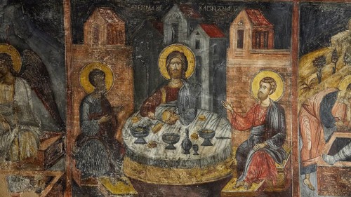 A fresco of the Last Supper with saints, dominating gold and brown tones, Easter 2025, Church of