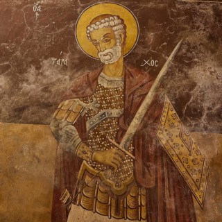 Saint with armour and halo, holding a weapon on an old church wall, Monastery Thari, Moni Thari,