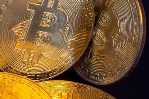 Close-up of symbolic bitcoins