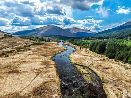 Mountains and Moors over Loch Tulla and River Orchy from a drone, Highlands, Scotland, UK