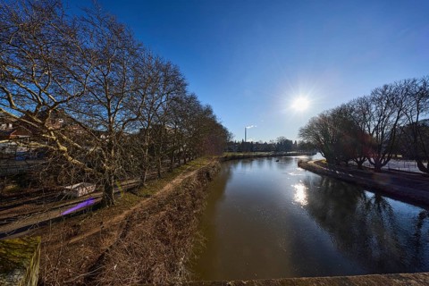 River Saar, bank, trees, meadow, abstract reflections, water surface, backlight of the sun, blue
