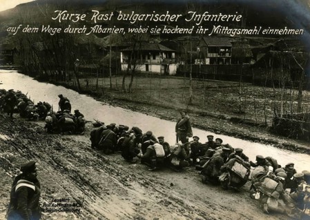 Short rest of Bulgarian infantry on their way through Albania, having their lunch while crouching,