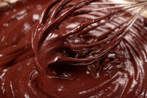 A bowl of chocolate dough, a whisk for whipping, baking, structure and consistency, homemade, top