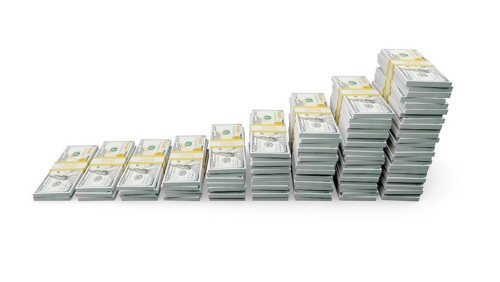 Rising stacks of money representing financial growth and wealth increase isolated on a white