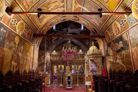 Ornamental church interior with frescoes and a magnificent iconostasis, monastery, Moni Thari, near