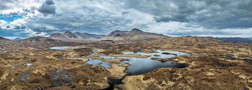 Panorama of Rannoch Moor from a drone over Loch Ba and Loch of the Armpit, A82 Highland Way, Argyll