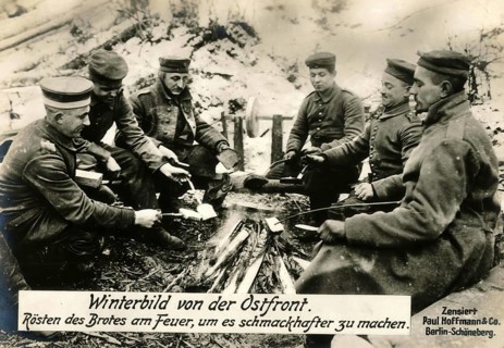 Winter picture from the eastern front. Roasting bread by the fire to make it more flavourful, 1914