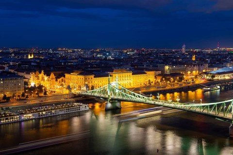 Evening panorama of Budapest with the Danube and the Liberty Bridge in the foreground