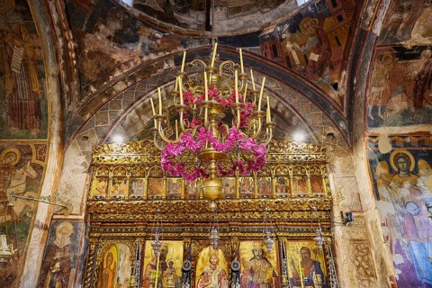 Magnificent interior of a church with golden details and frescoes, monastery, Moni Thari, near