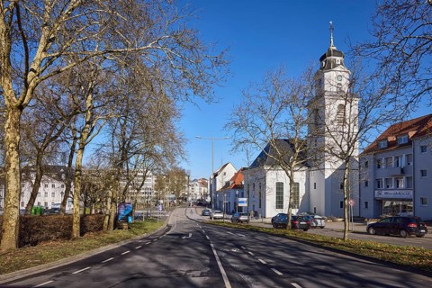 Friedenskirche Saarbrücken, bare trees, apartment buildings, street, blue sky, cloudless,