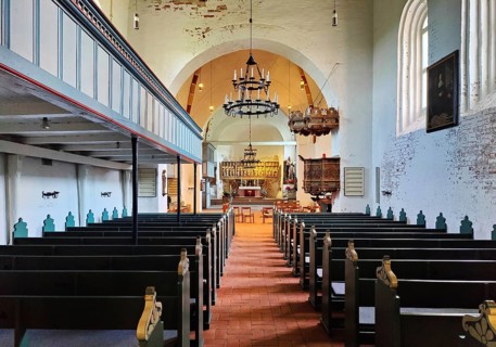 Evangelical Lutheran parish church of St. Johannis, view through the nave to the altar, Nieblum,