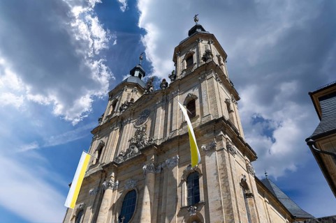 Parish and pilgrimage church of the Holy Trinity, basilica in Gößweinstein with pilgrimage flags,