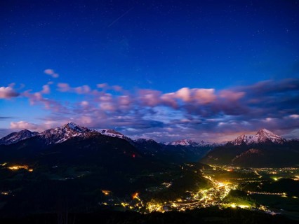 Starry sky at dawn over the valley basin of Berchtesgaden, behind Hoher Göll, Steinernes Meer and