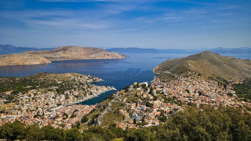 Wide island panorama with deep blue sea and sky, emphasises a peaceful atmosphere, Symi Town, Symi,