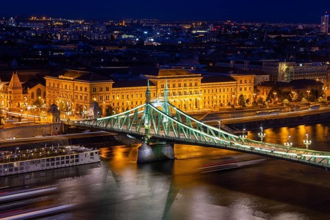 Evening panorama of Budapest with the Danube and the Liberty Bridge in the foreground