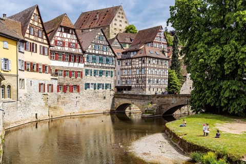 Town view with interesting half-timbered houses on the river Kocher. Historic old town centre of