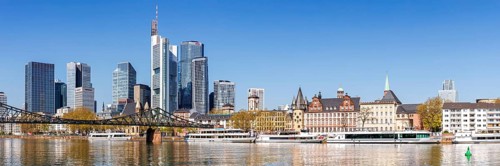 Frankfurt skyline skyscrapers with banks on the river Main panorama with excursion boats and