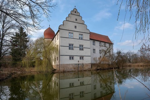 Moated castle, originally a manor house, converted into a Renaissance castle between 1612 and 1618,