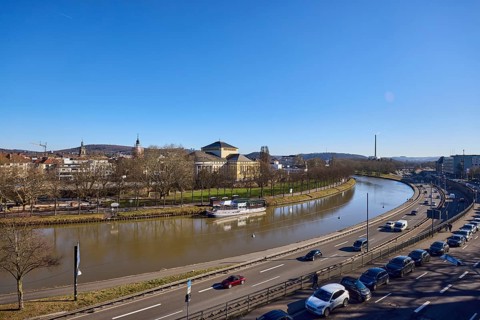 Long shot, Saarland State Theatre, general architecture, Saar river, streets, cars, trees, parking