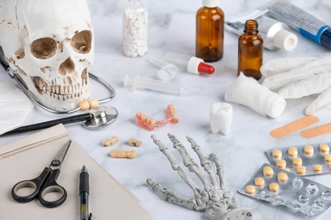 Dental supplies with skull, teeth and medical utensils