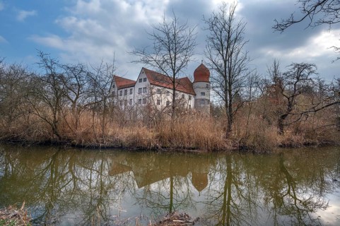 Moated castle, originally a manor house, converted into a Renaissance castle between 1612 and 1618,