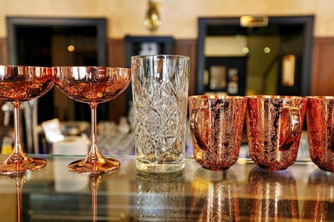 Various decorated glasses on a counter, classic coffee house, Central Grand Café, bar, Budapest,