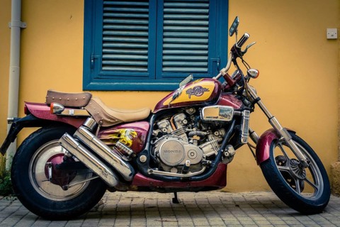 Honda Magna V45 motorcycle parked in front of a building