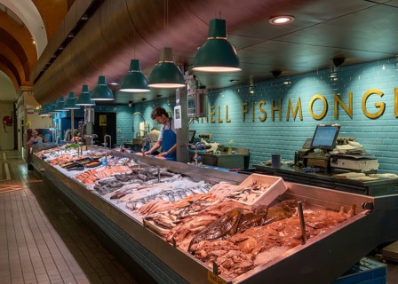 Cork, Ireland, 16 August, 2022: fishmonger market stall with fresh fish and seafood on ice inside