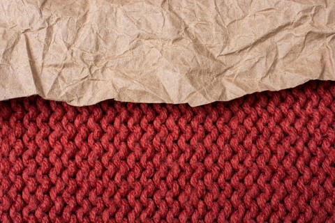 Fabric woven canvas texture with a wrinkled paper over it