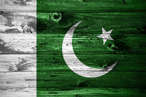 Pakistan flag on wooden planks background wood flag