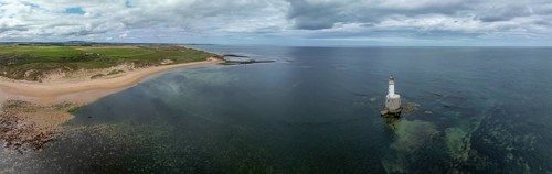 Lighthouse in the sea, drone shot, Rattray Head Lighthouse, Peterhead, Aberdeenshire, Scotland,