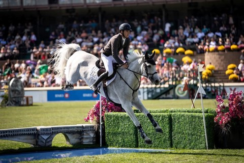 Donald Whitaker of Great Britain and riding Millfield Colette compete in the first round of the 1