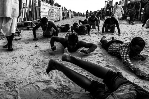 People crawling religious ritual ganga sagar kolkata west bengal India Asia