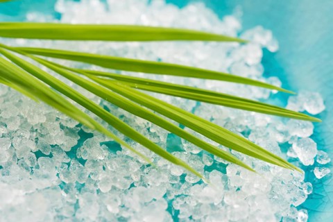 Bath salt and palm leaf