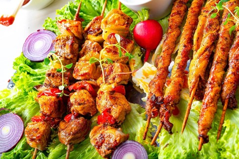 Grilled szaszlyk and meatballs with green salad