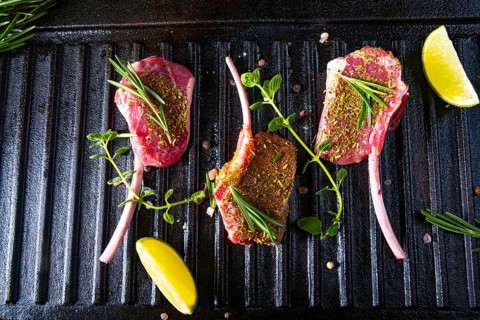 Seasoned and herb-marinated raw lamb chops
