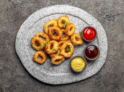 Food, Food, Fried squids rings on gray stone plate with sauces. Gray concrete background