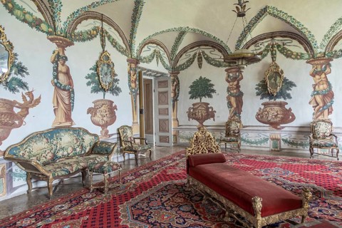 Masino, Italy, April 2023: baroque livingroom in old castle. Vintage interior, original from 18th