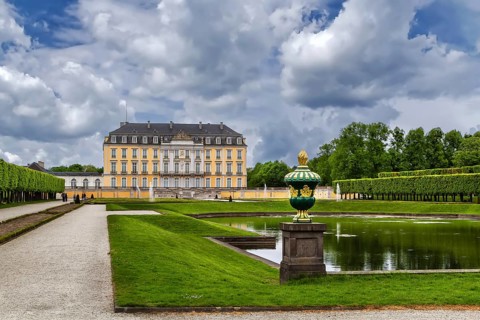 View of Augustusburg Palace with fountain and flower garden, Bruhl, Germany, Europe