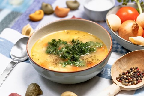 Chicken noodle soup with carrots and parsley