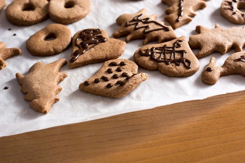 Decoration on gingerbread cookie close up. Baking with children