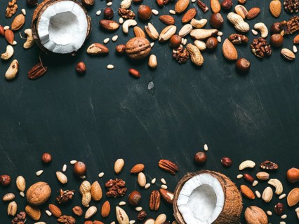 Background of mixed nuts - coconut, hazelnuts, walnuts, almonds, pecan, pistachio, brazil nut, pine