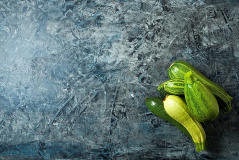 Vegetables on the background. Fresh vegetables (cucumbers, tomatoes, onions, garlic, dill, green