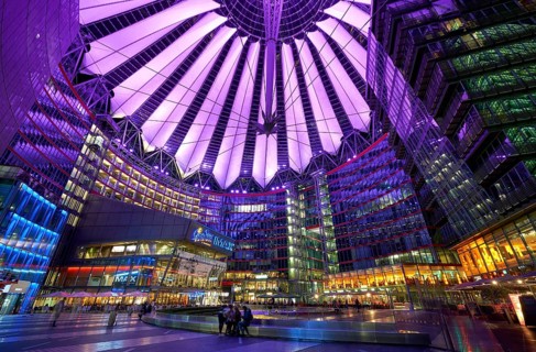 Sony Center in Berlin at night with purple lights on the ceiling